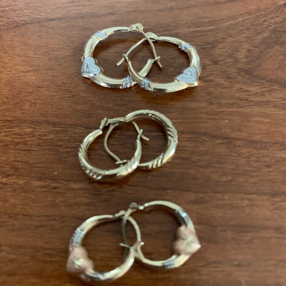 Three pair of gently used pierced earrings.